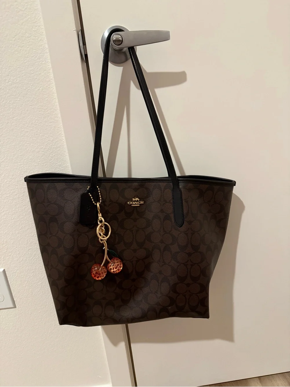 Coach Brown Logo Canvas Tote with Black Straps and Cherry Charm